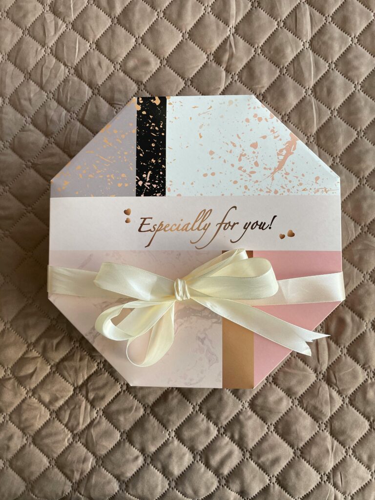Stylish hexagonal gift box with ribbon, perfect for special occasions and celebrations.